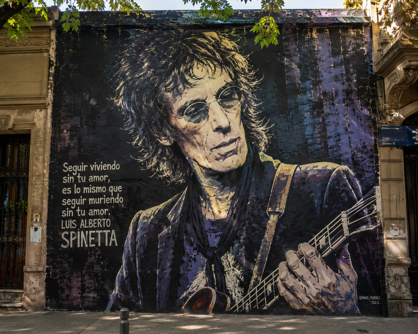 Street art mural of Argentine musician Luis Alberto Spinetta in Buenos Aires.